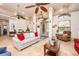 Spacious living room with tile floors, furniture, ceiling fans, lighting, and architectural details at 445 Se 98Th Ave, Webster, FL 33597
