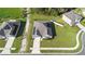 Aerial shot of a charming house with well-manicured yard and solar panels at 805 Baylor Dr, Deltona, FL 32725