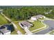 Beautiful aerial view of a charming house with lush lawn surrounded by green trees at 805 Baylor Dr, Deltona, FL 32725