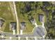 A bird's eye view of a single-Gathering home with a well-manicured lawn and a paved driveway at 805 Baylor Dr, Deltona, FL 32725