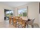 Bright dining area with view to screened in lanai and backyard at 805 Baylor Dr, Deltona, FL 32725