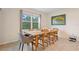 Bright dining area with view to large window and backyard at 805 Baylor Dr, Deltona, FL 32725
