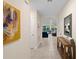 Hallway featuring an abstract painting that leads to the living room at 805 Baylor Dr, Deltona, FL 32725