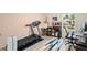 A Home Gym featuring exercise equipment like a treadmill and desk space for working out and working at home at 805 Baylor Dr, Deltona, FL 32725