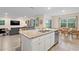 Open kitchen featuring granite countertops, stainless steel appliances, and an adjacent dining area at 805 Baylor Dr, Deltona, FL 32725