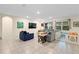 Open-concept living room with neutral tile flooring and lots of natural light at 805 Baylor Dr, Deltona, FL 32725