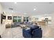 Bright living room with a large gray sectional sofa and an open concept design at 805 Baylor Dr, Deltona, FL 32725