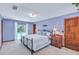 Charming bedroom with direct pool access, a lovely color palette, and sleek wooden furniture at 568 Gainsboro St, Deltona, FL 32725