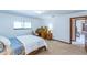 A stunning bedroom features a desk, plenty of light and a queen bed at 568 Gainsboro St, Deltona, FL 32725