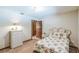Cozy bedroom featuring a floral bedspread and neutral decor at 568 Gainsboro St, Deltona, FL 32725