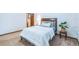 A beautiful bedroom featuring a bed, large plant, and dark wood trim at 568 Gainsboro St, Deltona, FL 32725
