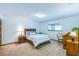 A beautiful bedroom is well lit with a large window and two night stands at 568 Gainsboro St, Deltona, FL 32725