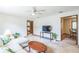Bright living room featuring neutral walls, a ceiling fan, and wood trim doorways for a warm and inviting space at 568 Gainsboro St, Deltona, FL 32725