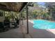 A gorgeous backyard pool with plenty of room for entertaining and mature landscaping at 568 Gainsboro St, Deltona, FL 32725