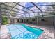 Sparkling pool under a screened enclosure, perfect for outdoor entertaining at 568 Gainsboro St, Deltona, FL 32725