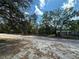 Charming single Gathering home with a gravel driveway nestled within a mature tree lined property at 9124 Sw 158Th Ln, Dunnellon, FL 34432