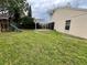 View of backyard featuring a playset, patio with pergola, and grassy yard at 12113 Calaboose Ct, Orlando, FL 32828