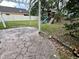 The backyard with wooden play set, patio, and well maintained lawn at 12113 Calaboose Ct, Orlando, FL 32828