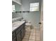 Bathroom featuring a single sink vanity and tiled floor at 12113 Calaboose Ct, Orlando, FL 32828