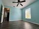 Bedroom featuring wood floors, fan and natural light at 12113 Calaboose Ct, Orlando, FL 32828