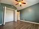 Spacious bedroom with wood floors, ceiling fan and a large closet at 12113 Calaboose Ct, Orlando, FL 32828