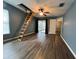 The bedroom has wood floors, a ceiling fan, and access to a patio at 12113 Calaboose Ct, Orlando, FL 32828