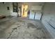 Functional garage space featuring a laundry area, water heater, and storage cabinets for added convenience and organization at 12113 Calaboose Ct, Orlando, FL 32828
