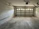 Spacious two-car garage with plenty of room for parking and storage, ready for your customization and organization at 12113 Calaboose Ct, Orlando, FL 32828