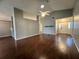 Open-concept living room features a high ceiling and wood floors at 12113 Calaboose Ct, Orlando, FL 32828