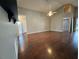 Spacious living room with wood floors, ceiling fan and bright natural light at 12113 Calaboose Ct, Orlando, FL 32828