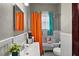 Charming bathroom with claw foot tub and vintage-style fixtures, window, and decorative shower curtain at 501 Washington Ave, Eustis, FL 32726