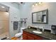 Updated bathroom featuring granite countertops, shower, framed mirror and recessed lighting at 501 Washington Ave, Eustis, FL 32726