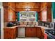 Well-lit kitchen featuring wooden cabinets, modern appliances, and ample counter space for cooking and preparation at 501 Washington Ave, Eustis, FL 32726