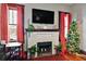 Living room features a white brick fireplace, adjacent workspace, and a Christmas tree at 501 Washington Ave, Eustis, FL 32726