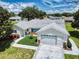 Aerial view of a charming single-story home with a well-manicured front yard at 13729 Se 89Th Ave, Summerfield, FL 34491