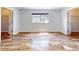 Bright, empty bedroom with wood floors, a window, and closet access at 13729 Se 89Th Ave, Summerfield, FL 34491