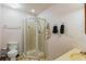 Bathroom with standard toilet, corner shower stall, and a vanity with towel racks at 1606 Center St, Deland, FL 32720
