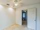 Spacious bedroom featuring a ceiling fan and an open doorway to another room at 1606 Center St, Deland, FL 32720
