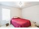 Cozy bedroom with ceiling fan, neutral carpet, and one window at 1606 Center St, Deland, FL 32720