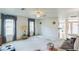 Spacious living room with neutral carpet, ceiling fan, and lots of natural light at 1606 Center St, Deland, FL 32720