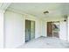 Covered patio with sliding glass doors and a ceiling light fixture at 1606 Center St, Deland, FL 32720