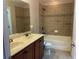 Bathroom featuring double sinks, vanity, and tiled tub-shower combo at 387 Winter Nellis Cir, Winter Garden, FL 34787