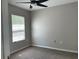 Bedroom featuring neutral walls, carpet floors, and ceiling fan at 387 Winter Nellis Cir, Winter Garden, FL 34787