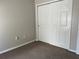Bedroom featuring neutral walls, carpet floors, and closet at 387 Winter Nellis Cir, Winter Garden, FL 34787