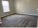 Bedroom featuring neutral walls, carpet floors, and window at 387 Winter Nellis Cir, Winter Garden, FL 34787
