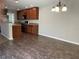 Open-concept kitchen features wood cabinets, breakfast bar, and modern appliances at 387 Winter Nellis Cir, Winter Garden, FL 34787