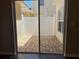 View of the private brick-paved patio accessible through sliding glass doors at 387 Winter Nellis Cir, Winter Garden, FL 34787