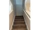 Carpeted stairs with white railing leading to the upper level at 387 Winter Nellis Cir, Winter Garden, FL 34787