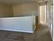 Carpeted upstairs landing with view of an adjoining bedroom at 387 Winter Nellis Cir, Winter Garden, FL 34787