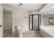Bright bathroom featuring a corner shower, tub, and modern fixtures at 15690 Sw 46Th Cir, Ocala, FL 34473